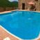 Private, shared pool with large sun-deck, where you can have your table + chairs for alfesco eating !